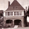 <p><strong>Romanesque Revival</strong>: Commanding Officer&#39;s Quarters (Building 1), east facade with enclosed second-floor sun porch (added about 1938), view west, ca. 1939.</p>